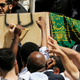 Mourners carry the casket of Abdirahman Abdi during his funeral on July 29.